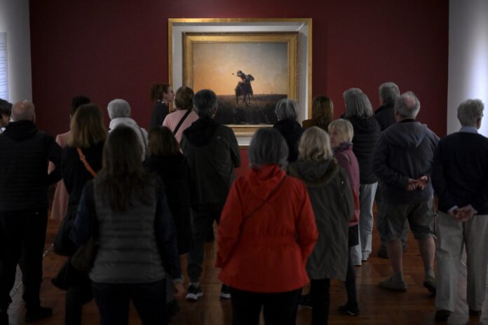 People looking at art in museum